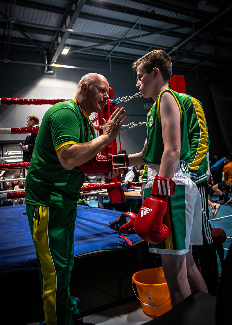 Coach and boxer together at ringside